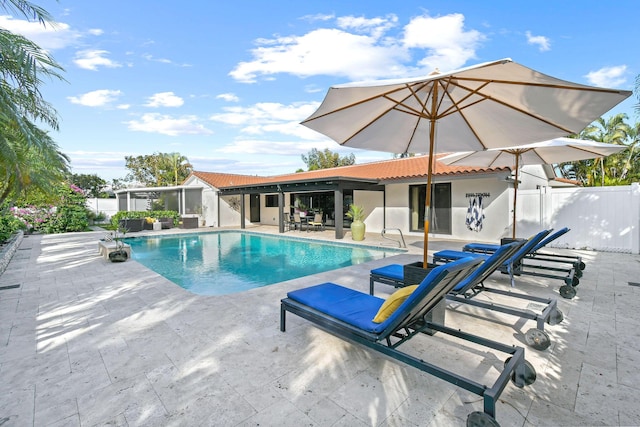 view of swimming pool featuring a patio area