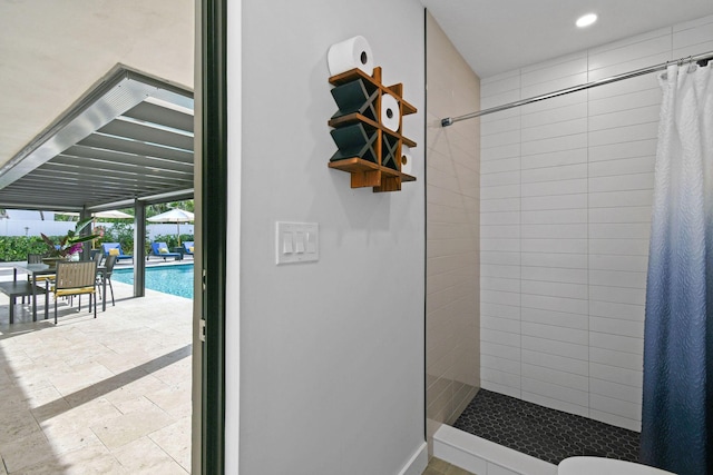 bathroom with a shower with curtain and expansive windows