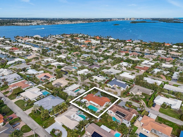 birds eye view of property with a water view