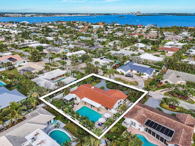 birds eye view of property with a water view