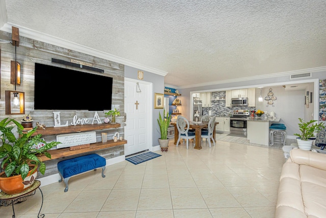 tiled living room with a textured ceiling and ornamental molding