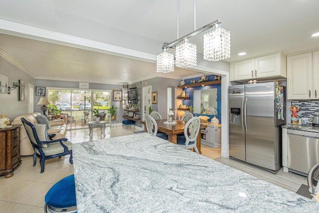 dining room featuring ornamental molding