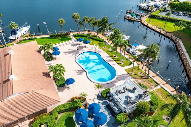 birds eye view of property with a water view