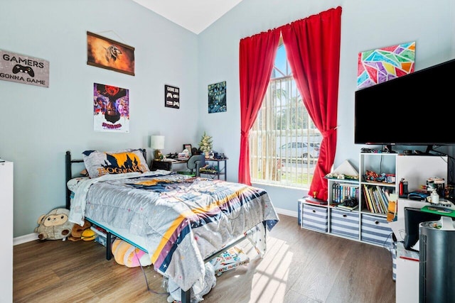 bedroom with hardwood / wood-style floors