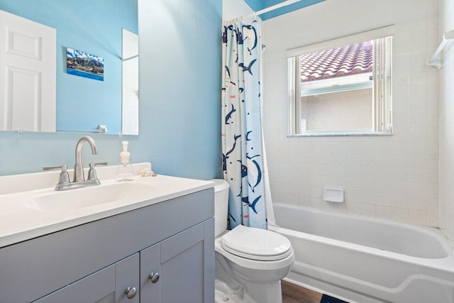 full bathroom featuring shower / bath combination with curtain, toilet, wood-type flooring, and vanity