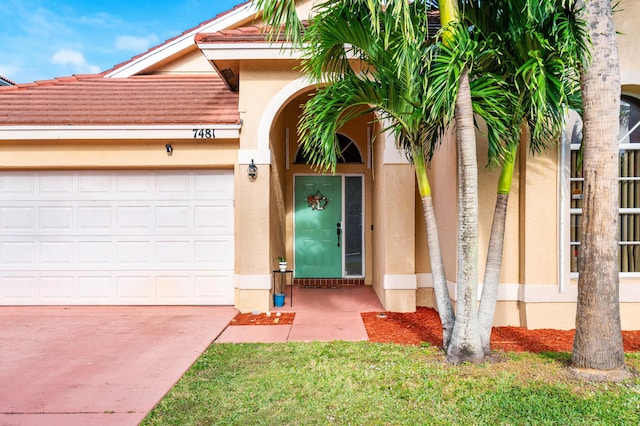 view of exterior entry featuring a garage