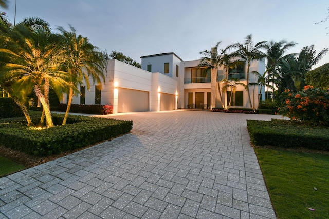 view of front of house with a balcony and a garage