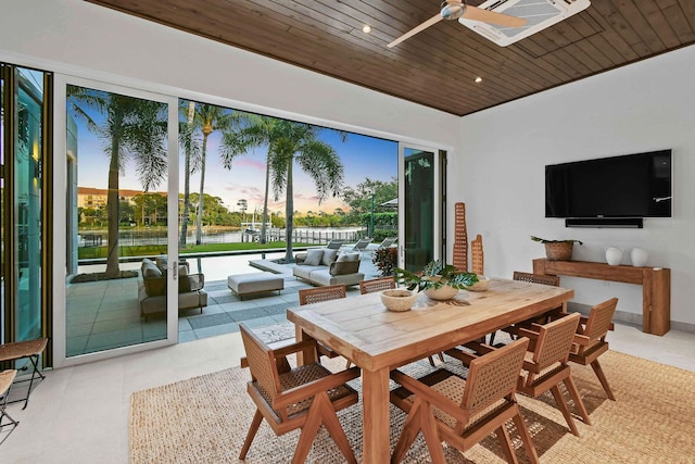 interior space with ceiling fan and wooden ceiling