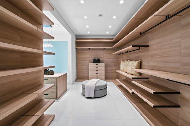 spacious closet with light tile patterned floors