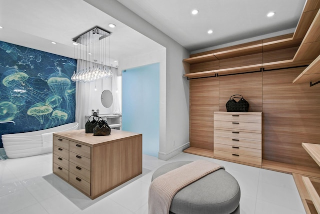 walk in closet featuring light tile patterned floors