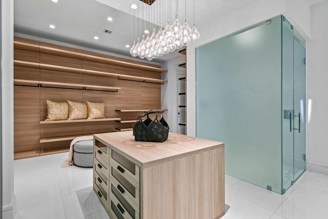 walk in closet featuring light tile patterned floors