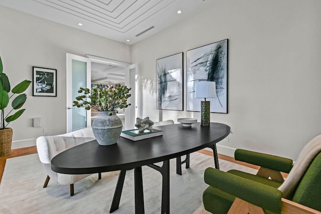 dining space with light hardwood / wood-style flooring