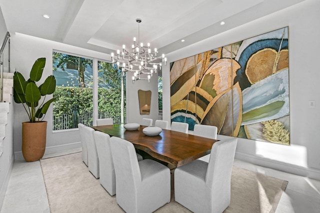 dining room with a chandelier and a tray ceiling