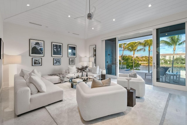 living room featuring a water view, ceiling fan, and wooden ceiling