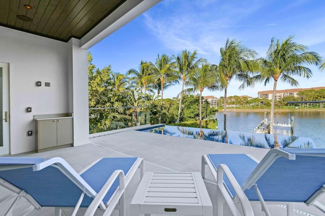 view of patio with a water view