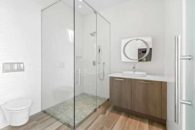 bathroom with vanity, toilet, an enclosed shower, and tile walls