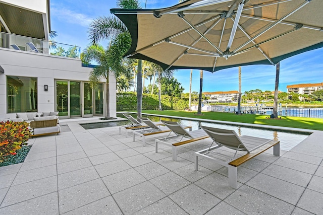 view of patio featuring a water view