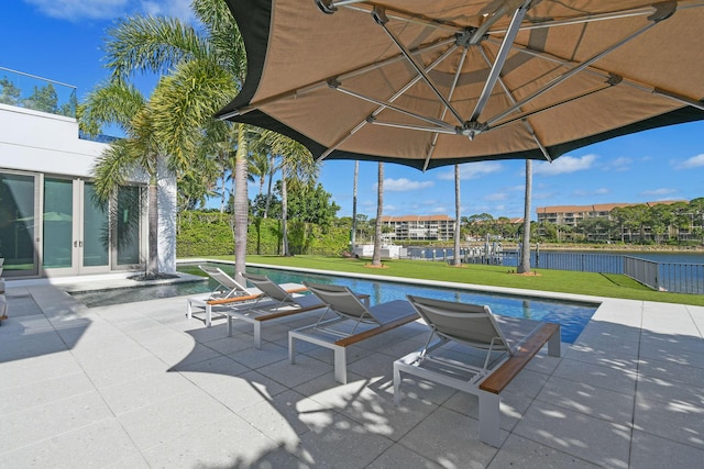 view of patio featuring french doors and a water view