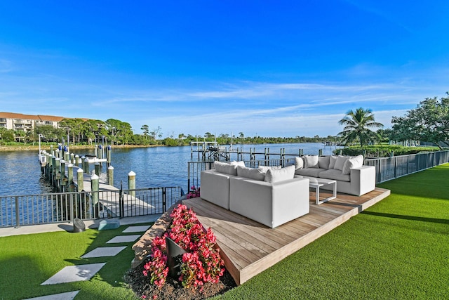 view of dock featuring a yard, a water view, and an outdoor hangout area