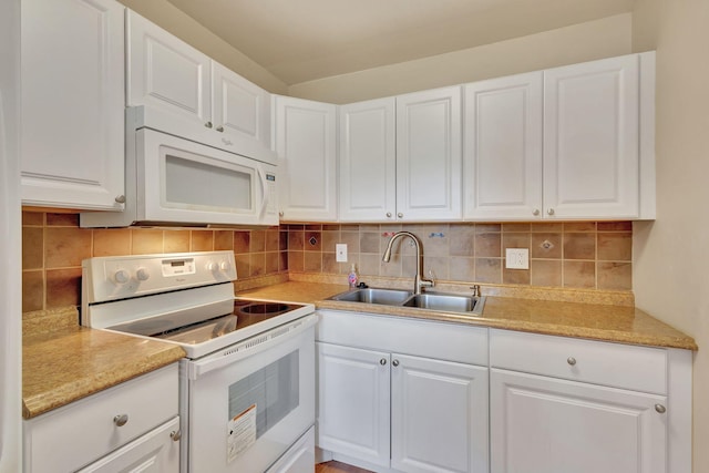 kitchen with white cabinets, white appliances, and sink