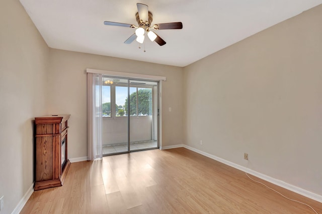 unfurnished room with ceiling fan and light wood-type flooring