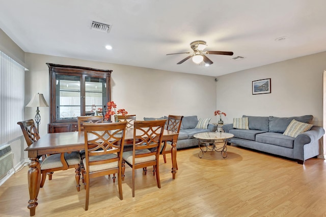 dining space featuring ceiling fan and light hardwood / wood-style flooring