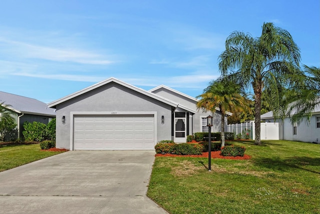 single story home featuring a garage and a front yard