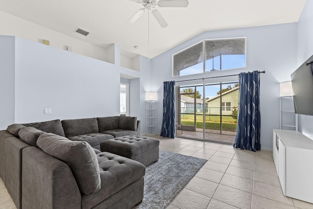 tiled living room featuring a high ceiling and ceiling fan