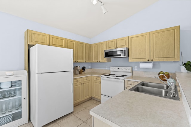 kitchen with sink, light brown cabinets, lofted ceiling, white appliances, and light tile patterned floors