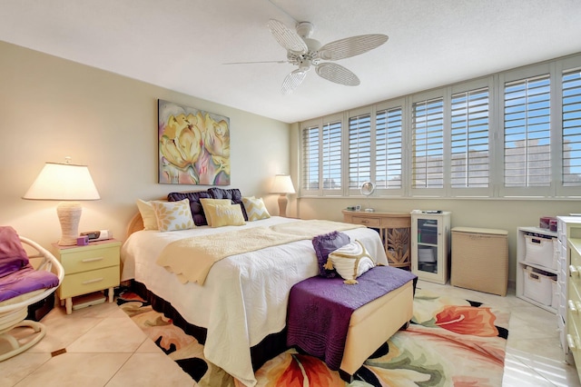 tiled bedroom with ceiling fan