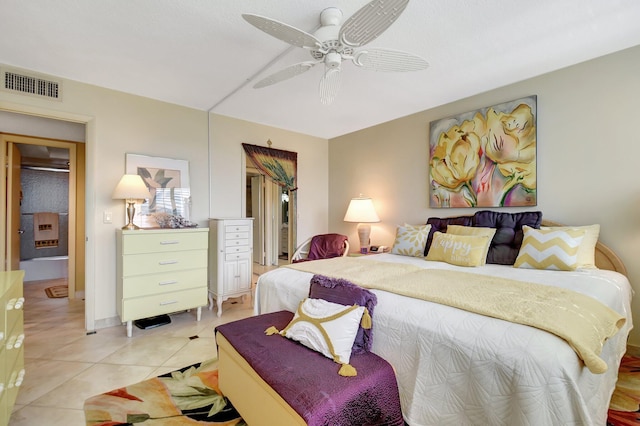 bedroom featuring light tile patterned floors and ceiling fan