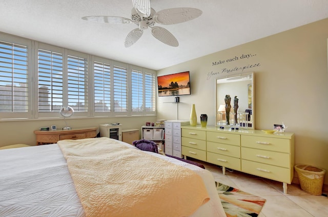 bedroom featuring ceiling fan and light tile patterned flooring