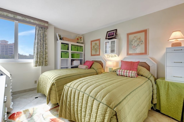 bedroom with light tile patterned floors