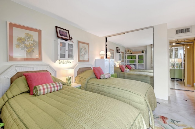 bedroom with light tile patterned floors