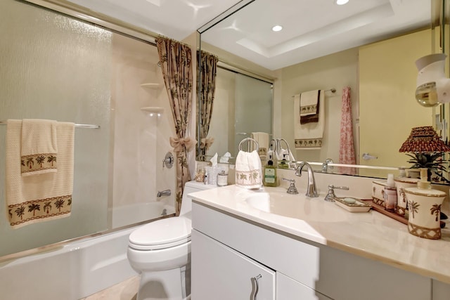 full bathroom with vanity, toilet, a raised ceiling, and shower / bath combo with shower curtain