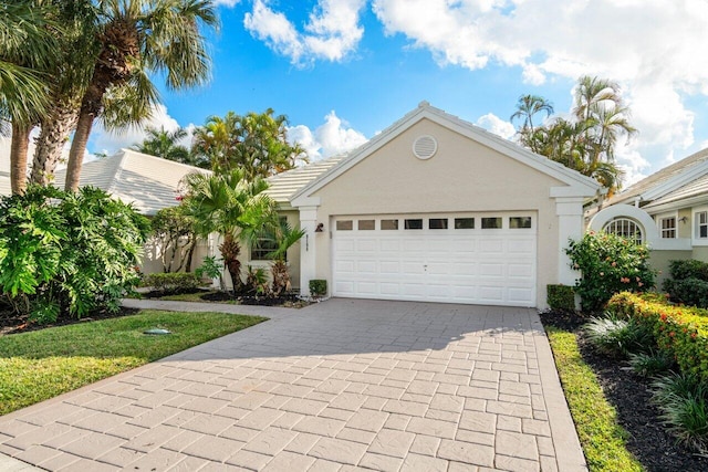 ranch-style home featuring a garage