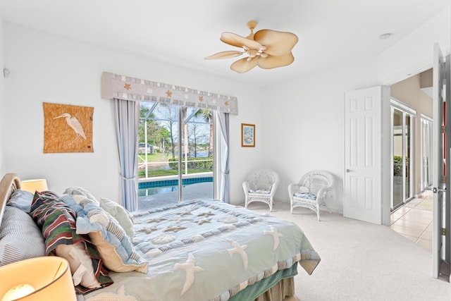 carpeted bedroom featuring ceiling fan and access to exterior