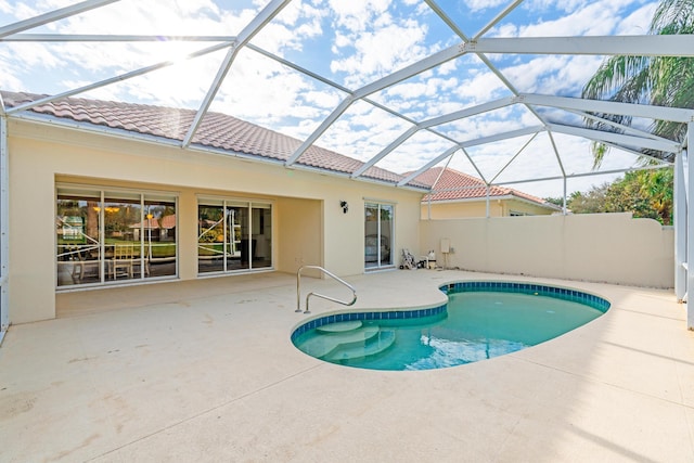 view of pool featuring a lanai and a patio area