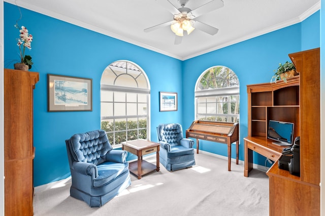 sitting room featuring carpet floors, a healthy amount of sunlight, ceiling fan, and ornamental molding