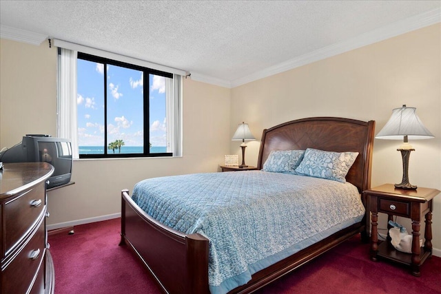 carpeted bedroom with a textured ceiling and ornamental molding