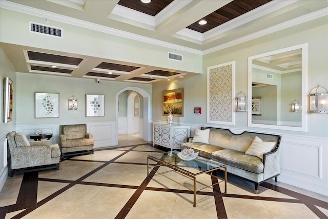 living room with beam ceiling, coffered ceiling, and ornamental molding