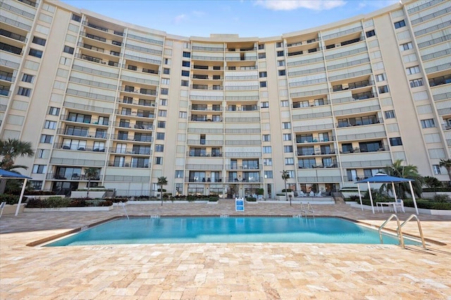 view of pool featuring a gazebo and a patio area