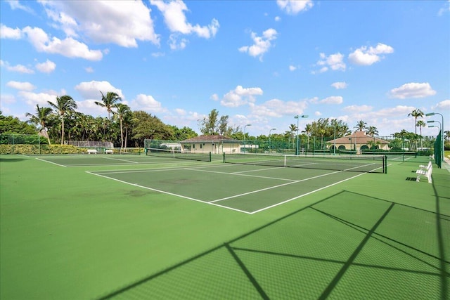 view of sport court featuring fence