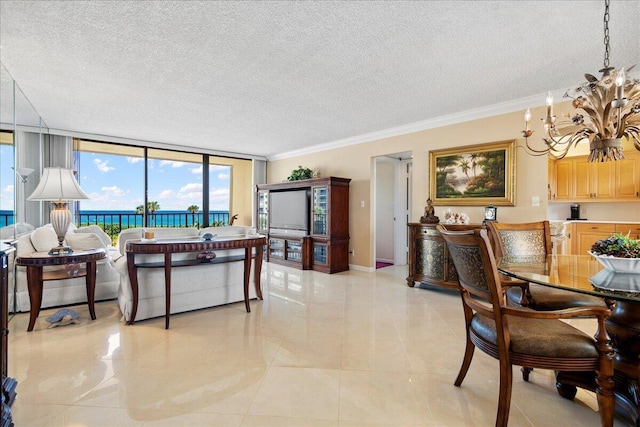 tiled living room featuring a chandelier, a textured ceiling, floor to ceiling windows, and crown molding