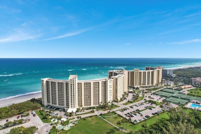 bird's eye view featuring a water view and a view of the beach