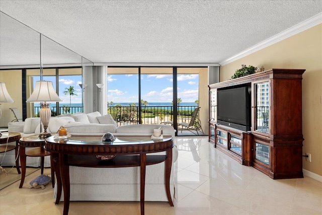 tiled living room with a textured ceiling, a water view, expansive windows, and ornamental molding