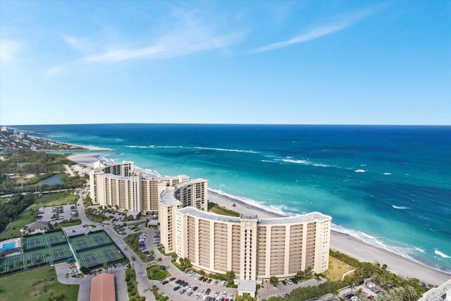 drone / aerial view with a water view and a view of the beach