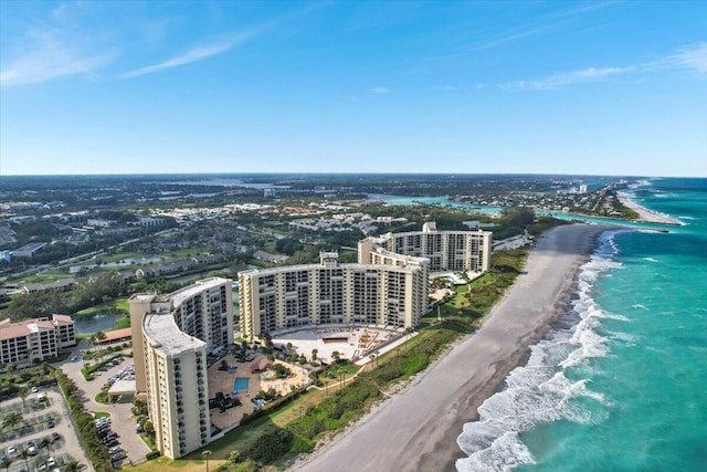 bird's eye view featuring a water view and a view of the beach