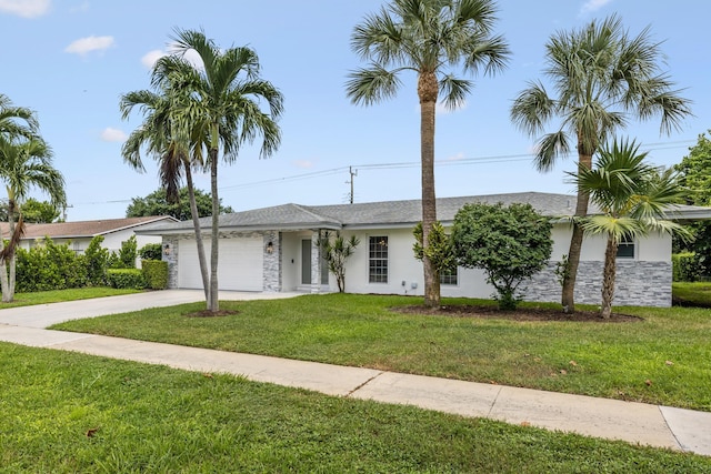 ranch-style home featuring stucco siding, driveway, a front yard, and a garage