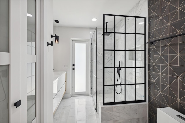 full bathroom featuring recessed lighting, a shower stall, and vanity